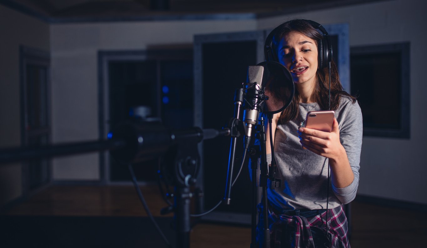 Female Playback Singer with Mobile Phone